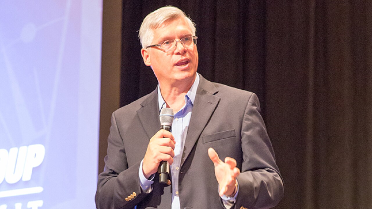 UFG CEO Ray Titus announcing the addition of Paramount Tax & Accounting to its franchise portfolio.