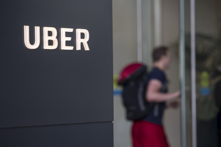 Uber Technologies signage is displayed outside the company's headquarters building in San Francisco.