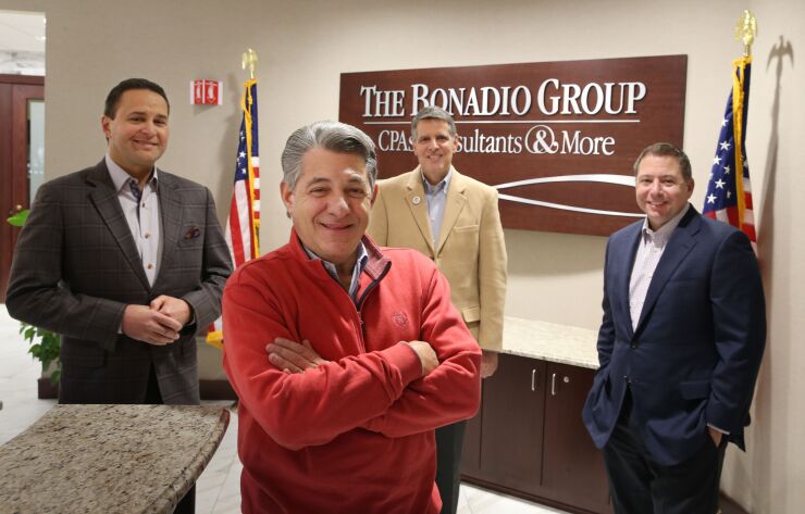 The Bonadio Group's Management Committee: (left to right) Rochester office managing partner Bruce Zicari, CEO Thomas Bonadio, chairman and Buffalo office managing partner Mario Urso, COO Robert Enright