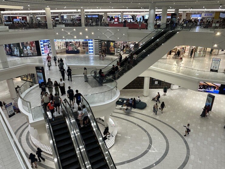 Shoppers at American Dream take the escalators between the mall's three floors.
