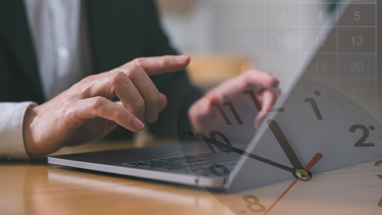 Man typing on laptop, view of clock, employee working a lot