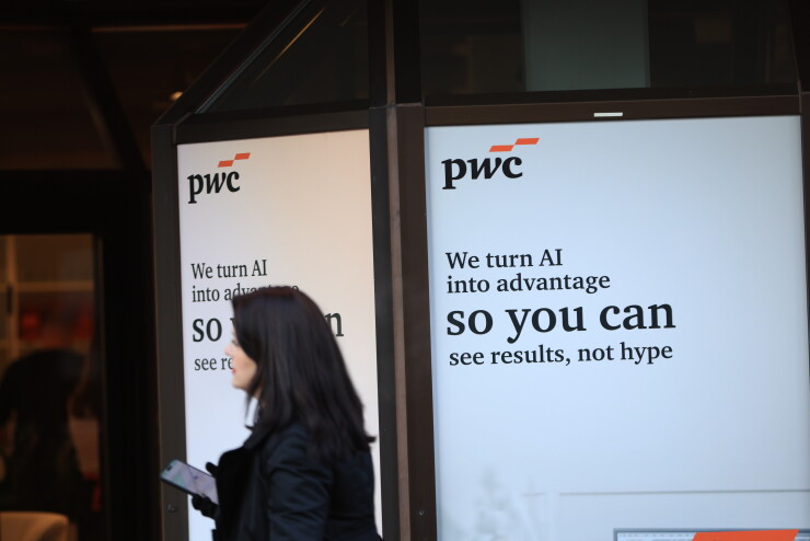 A PricewaterhouseCoopers sign in Davos