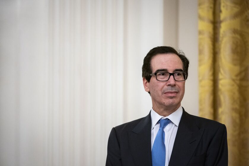 Treasury Secretary Steven Mnuchin listens during a Paycheck Protection Program event in the East Room of the White House in Washington April 28, 2020.