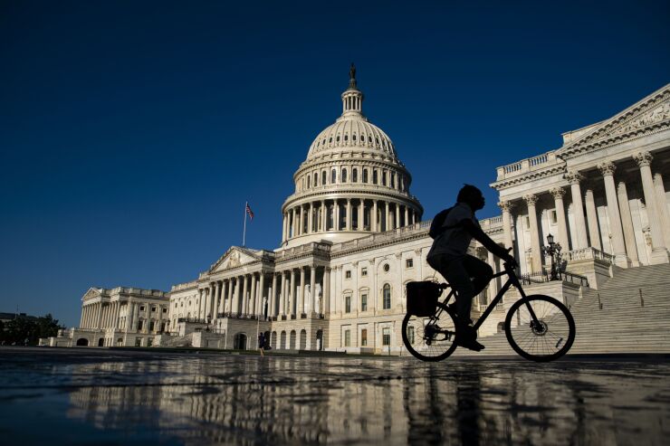 A bicyclist near the US Capitol in Washington, D.C., US, on Monday, June 6, 2022. Amid signs of internal discord, the US Supreme Court is waiting until the bitter end to do the largest share of its work in more than 70 years. Photographer: Al Drago/Bloomberg