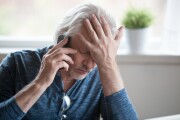 Frustrated mature old white man upset desperate phone call