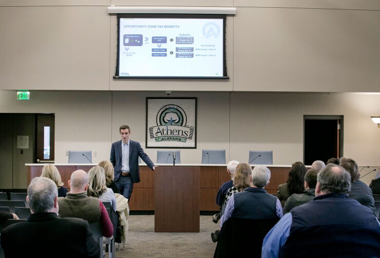 Alex Flachsbart gives a presentation on opportunity zones in Athens, Alabama.