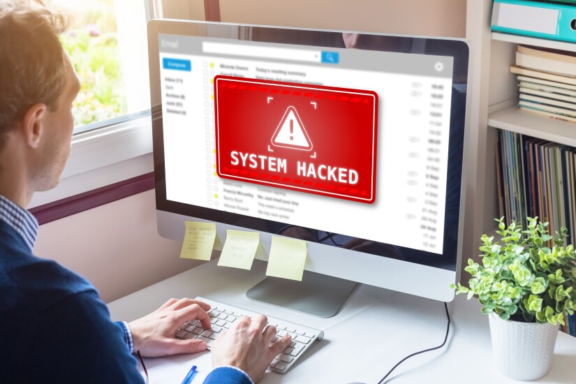 System hacked alert on computer screen after cyber attack on net