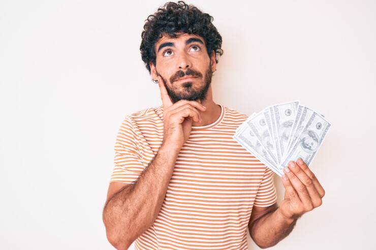 Man thinking about what to do with money