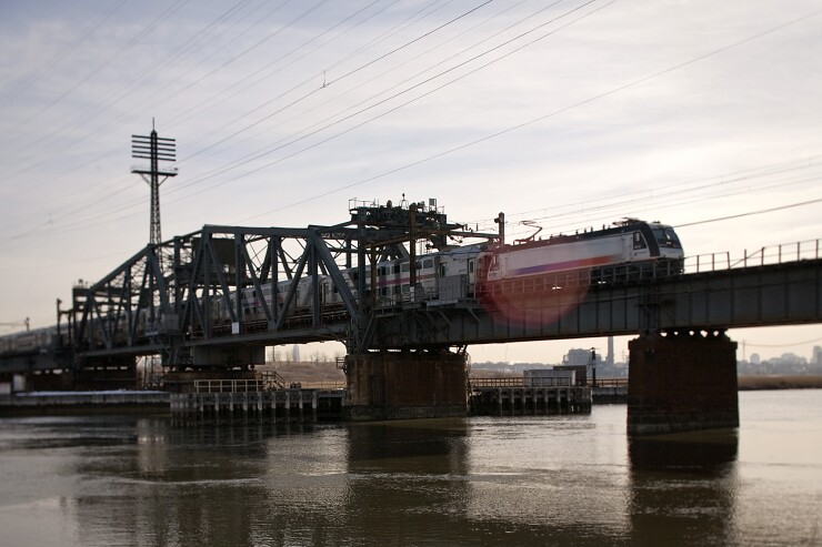 A New Jersey Transit train crosses over the Hackensack River on the Portal Bridge between Kearny and Secaucus, New Jersey, U.S., on Wednesday, Feb. 9, 2011.