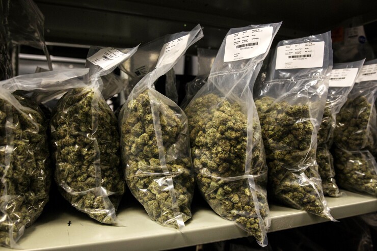 Packages of marijuana are seen on a shelf before shipment at the Canopy Growth Corp. facility in Smith Falls, Ontario.