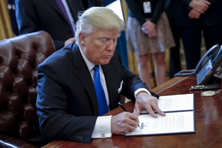 Donald Trump signing an executive order