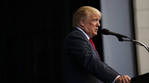 Donald Trump at a mic