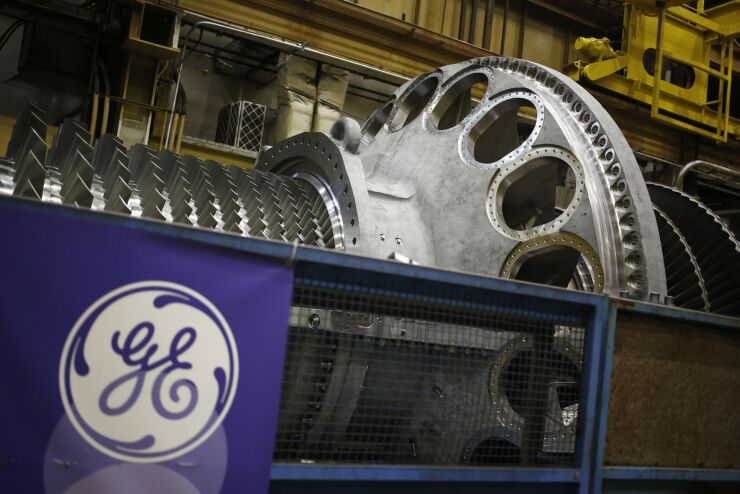 General Electric steam turbine logo pension defined benefits plan Bloomberg News