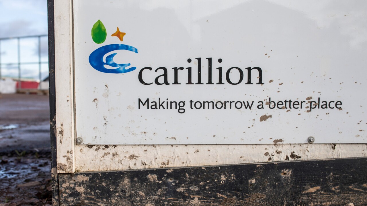 The Carillion Plc logo sits on hoarding surrounding the Midland Metropolitan Hospital construction site, operated by Carillion, in Smethwick, U.K.