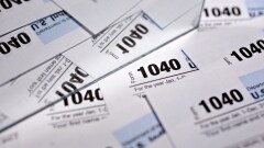 U.S. Department of the Treasury Internal Revenue Service (IRS) 1040 Individual Income Tax forms for the 2016 tax year are arranged for a photograph in Tiskilwa, Illinois, U.S., on Monday, Dec. 18, 2017. This week marks the last leg of Republicans' push to revamp the U.S. tax code, with both the House and Senate planning to vote by Wednesday on final legislation before sending it to President Donald Trump. Photographer: Daniel Acker/Bloomberg