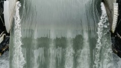 Water rushing through the gates at a hydroelectric dam