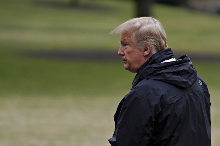 President Trump waits on the South Lawn of the White House before boarding Marine One in Washington on March 8, 2019.