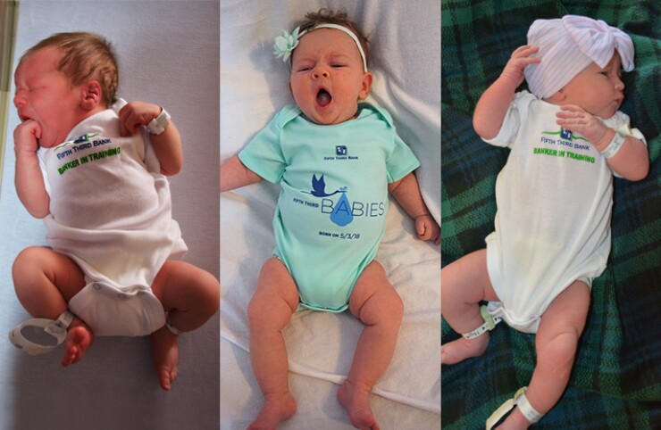Babies modeling onesies given out this year and last year on May 3 by Fifth Third Bancorp. It's all part of an unconventional marketing campaign.