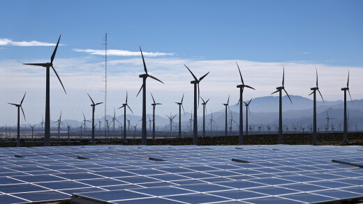 Wind turbines operate at a wind farm near solar panels near Palm Springs, California.