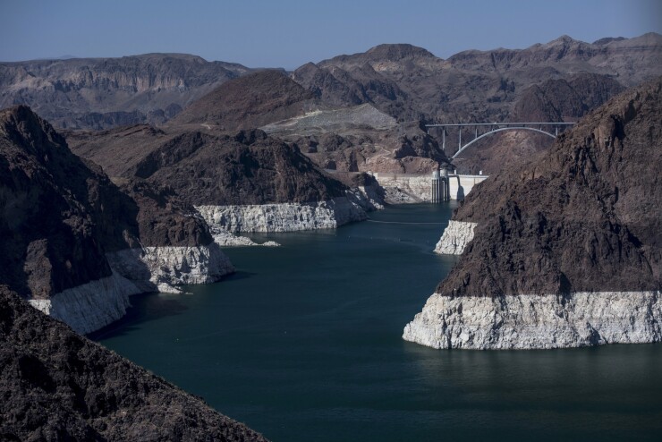 Lake Mead, the Hoover Dam, and the Mike O'Callaghan-Pat Tillman Memorial Bridge stand in this aerial photograph taken above Boulder City, Nevada, U.S., on Wednesday, June 3, 2015.