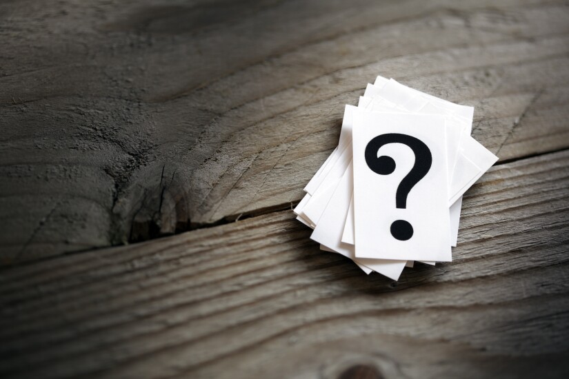 question mark cards on wood background