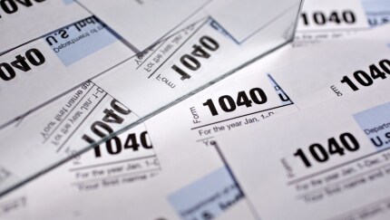 U.S. Department of the Treasury Internal Revenue Service (IRS) 1040 Individual Income Tax forms for the 2016 tax year are arranged for a photograph in Tiskilwa, Illinois, U.S., on Monday, Dec. 18, 2017. This week marks the last leg of Republicans' push to revamp the U.S. tax code, with both the House and Senate planning to vote by Wednesday on final legislation before sending it to President Donald Trump. Photographer: Daniel Acker/Bloomberg