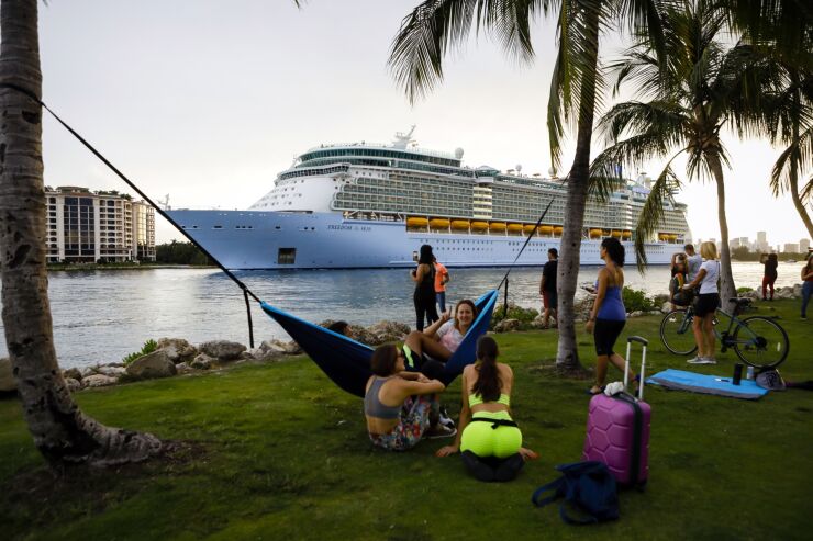 The Royal Caribbean Cruises Freedom of the Seas ship departs for a simulated voyage from PortMiami in Miami, Florida, on June 20, 2021.