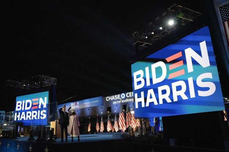 Joe Biden, 2020 Democratic presidential nominee, left, and wife Jill Biden, wave as they exit an election night party in Wilmington, Delaware, U.S., on Wednesday, Nov. 4, 2020. President Donald Trump has once again defied polls and predictions, with a strong showing across the Sun Belt in early results appearing to significantly shrink Biden's path to victory. Photographer: Stefani Reynolds/Bloomberg