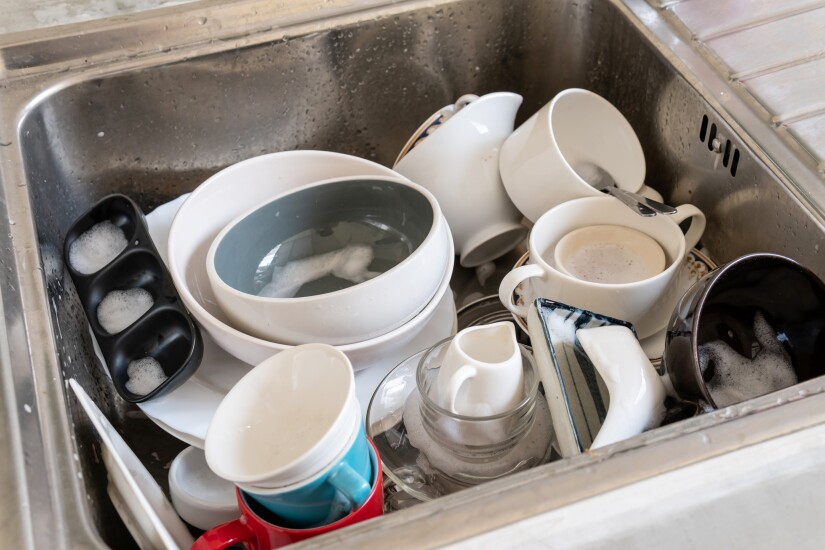 A sink filled with dirty dishes