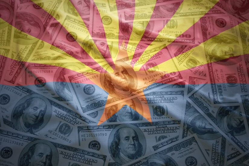 colorful waving arizona state flag on a american dollar money background