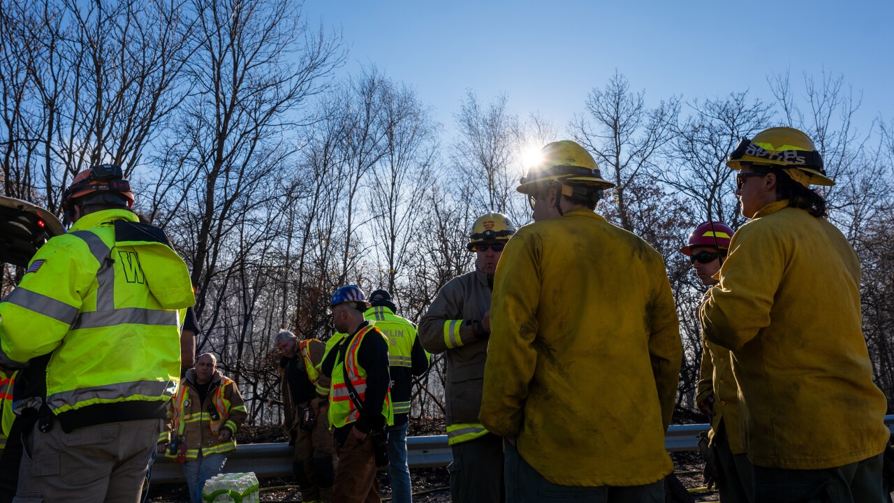 Fire people and emergency services in high visibility safety gear