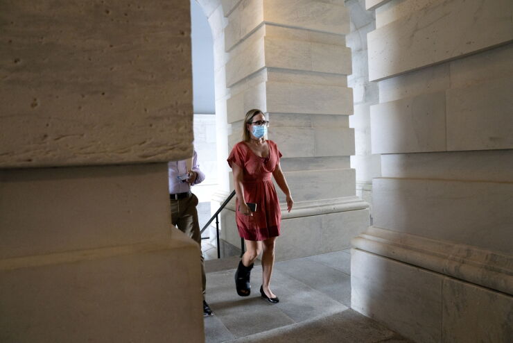 sinema-kyrsten-senate-masked-walking.jpg