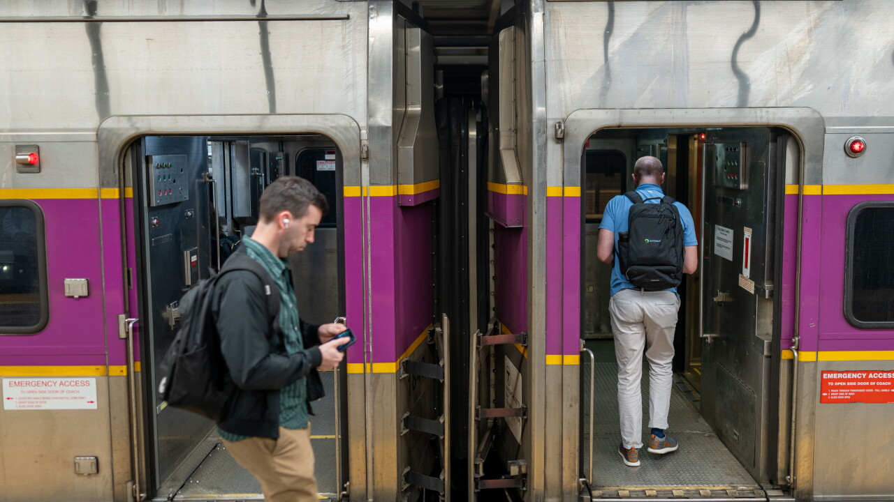 Passengers board an MBTA Commuter Rail train.