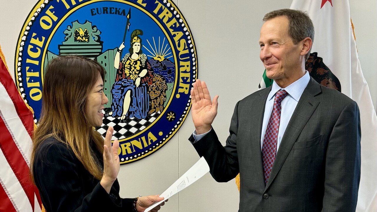 California State Treasurer Fiona Ma swears Deputy Treasurer John Sheldon into office.