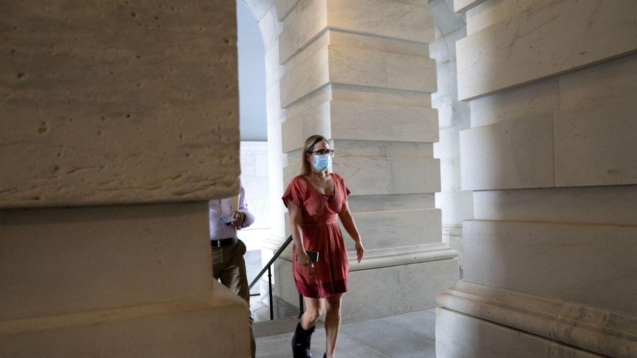 sinema-kyrsten-senate-masked-walking.jpg