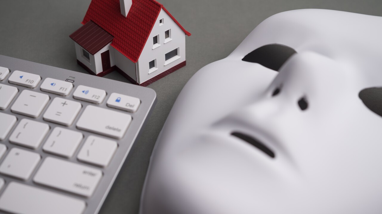 House, keyboard computer, white mask scammer on gray background. Real estate, property, land, rental, mortgage closing scams concept. Protect money from real estate scams when buying, rental a home.