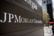 Signage stands on display outside the JPMorgan & Chase Tower in downtown Chicago, Illinois, U.S., on Saturday, Oct. 7, 2017. AKA J.P. Morgan.