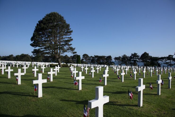 French national flags and American flags at the World War II Normandy American Cemetery and Memorial in Colleville-sur-Mer, France, on June 6, 2019.