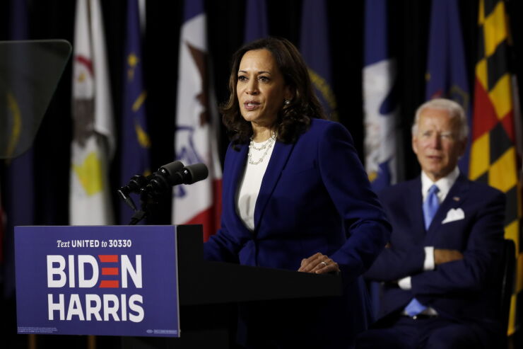 Sen. Kamala Harris speaks as former Vice President Joe Biden listens during a campaign event in Wilmington, Delaware, on Aug. 12, 2020.
