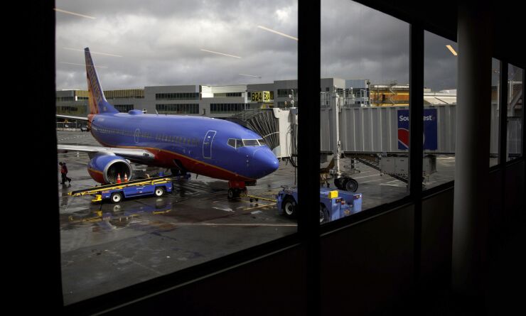 A Southwest aircraft stands on the tarmac at San Francisco International Airport. 