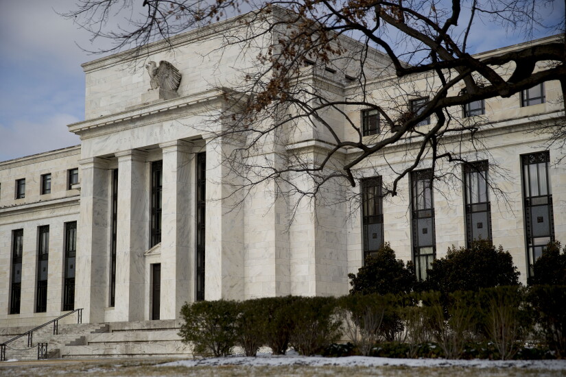 The Marriner S. Eccles Federal Reserve building stands in Washington, D.C., U.S., on Tuesday, Jan. 27, 2015. The Federal Reserve Board joins with the Office of the Comptroller of the Currency and the Federal Deposit Insurance Corporation in pushing for higher capital requirements for large banks.