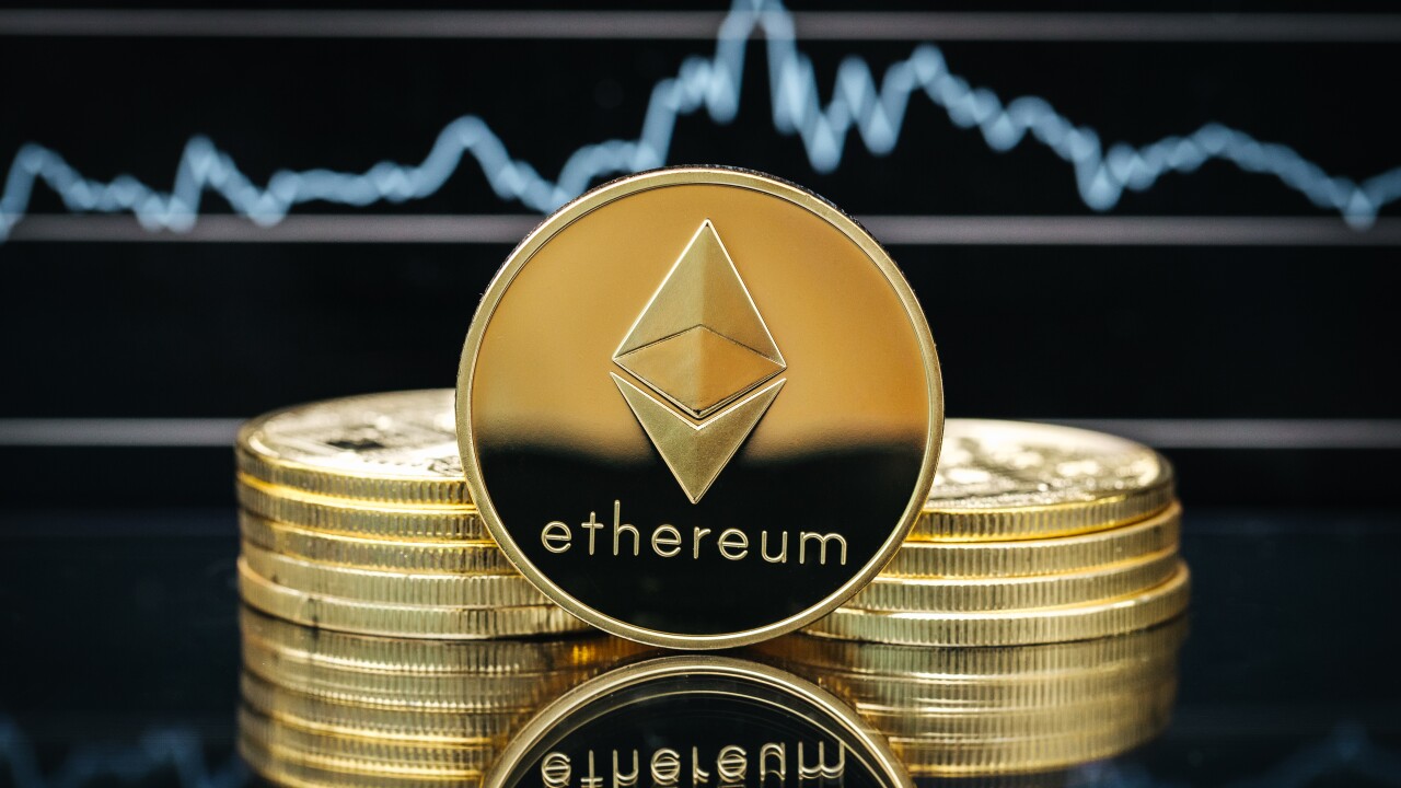 Ethereum cryptocurrency, physical coin close-up, in front of a price chart Ether ethereum digital asset crypto