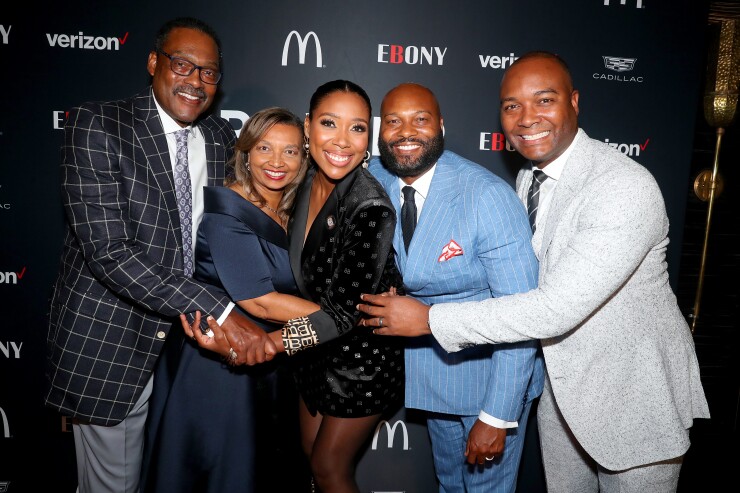 Junior Bridgeman, his wife Doris, his daughter Eden Bridgeman Sklenar and his sons Justin and Ryan posed together at the EBONY Power 100 Kickoff in October 2021.