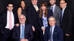 After more than a decade with Wells Fargo, a nine-member team moved its practice to Raymond James for its corporate culture and platform. Left to right: (Seated) Stephen Adler, Mark Levy, (Standing) Michael Lubin, Allison Guzman, Christopher Swanson, Loriann Montanez, Stephen Orzo, Roger Jee