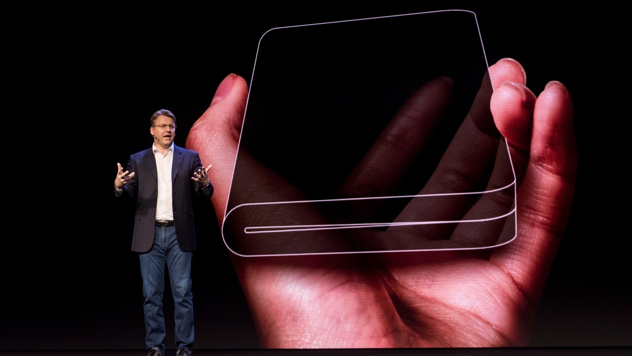 Justin Denison, senior vice president of product strategy and marketing for Samsung Electronics America, shows off a new phone with a foldable screen during the Samsung Developers Conference in San Francisco in early November 2018.