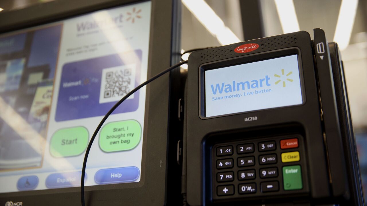 Walmart self-checkout screen and card reader