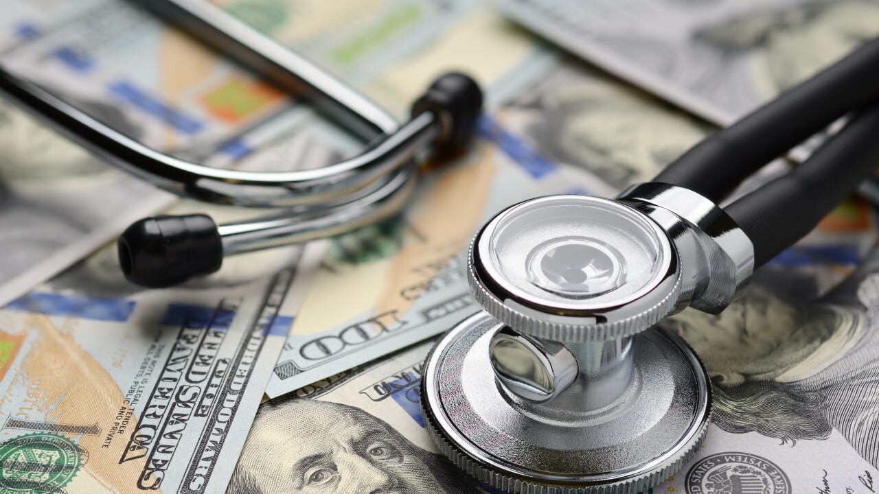 Medical stethoscope and dollar bills