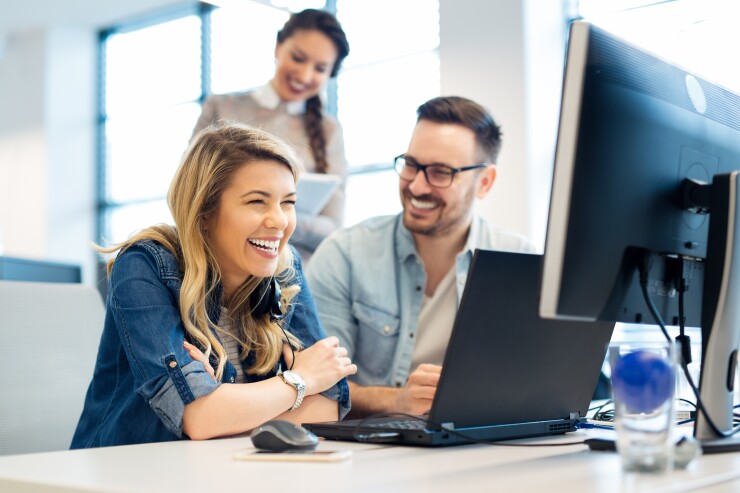 Employees looking at computer
