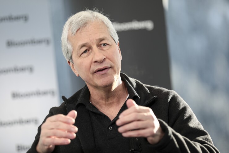 Jamie Dimon, chief executive officer of JPMorgan Chase, gestures as he speaks during an interview at the World Economic Forum in Davos, Switzerland.