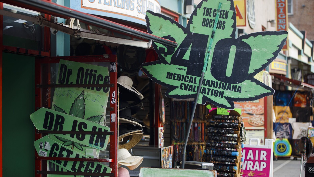 Signage advertising "The Green Doctors $40 Medical Marijuana Evaluations" are displayed in the Venice Beach neighborhood of Los Angeles.